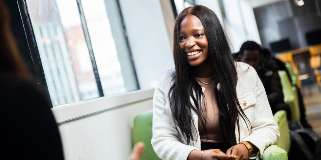 Student smiling after discussing her freelance opportunities.